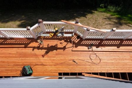 Contractors installing a wood deck
