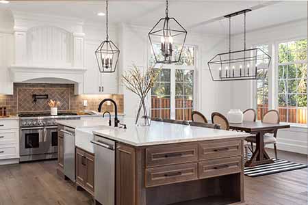 View of newly remodeled kitchen with white walls and cabinets