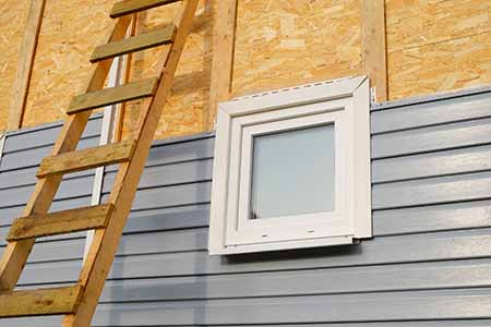 installing gray vinyl siding